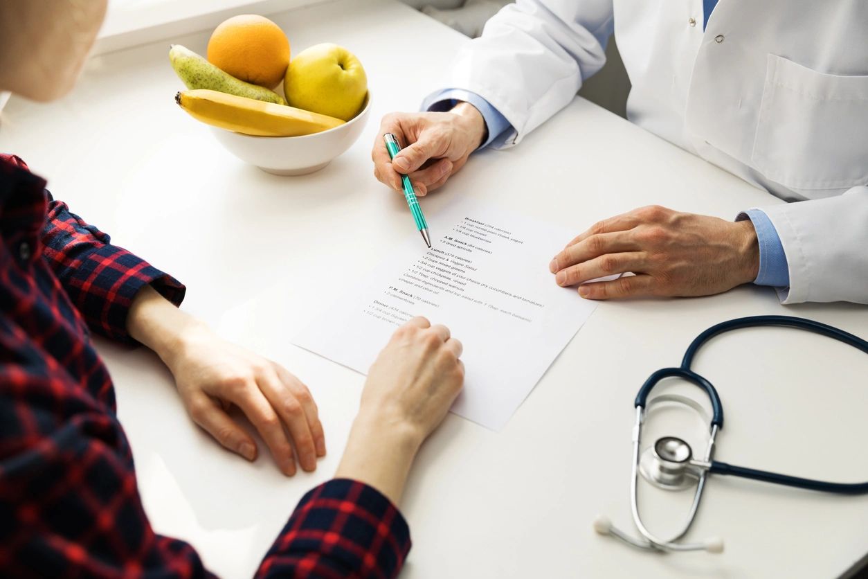 Patient and doctor reviewing health document